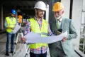 engineer-foreman-and-worker-discussing-in-building-construction-site-3-e1600417370299